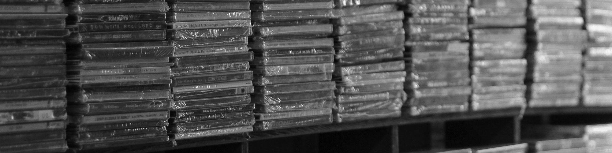 A huge shelf of CDs, ready for distribution