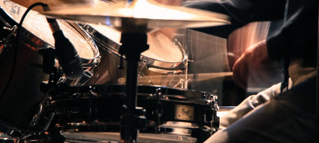 A drum kit being played with heavy technique, similar to what can be achieved using parallel compression.