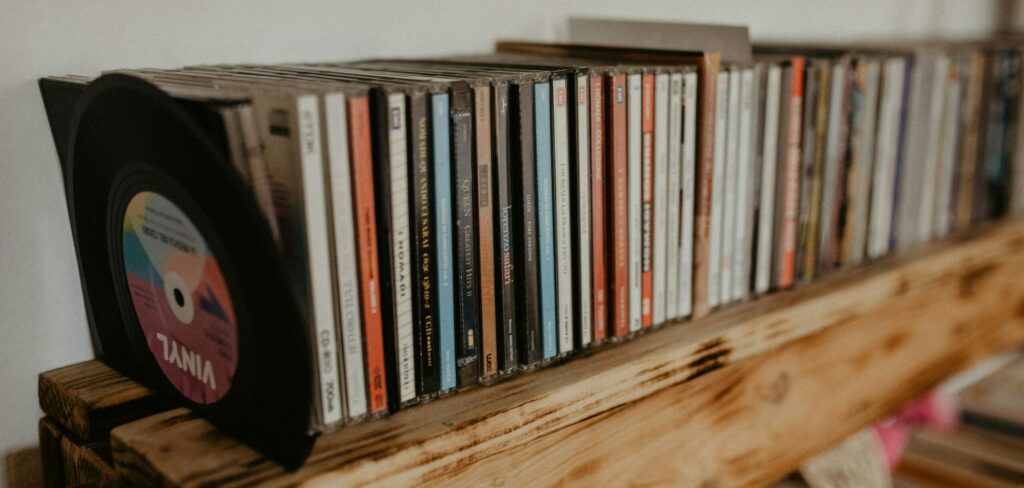 A pile of red book audio CDs