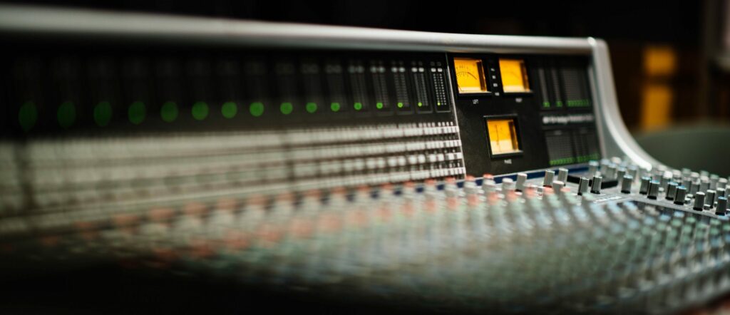 Working the de-esser on the mixing console