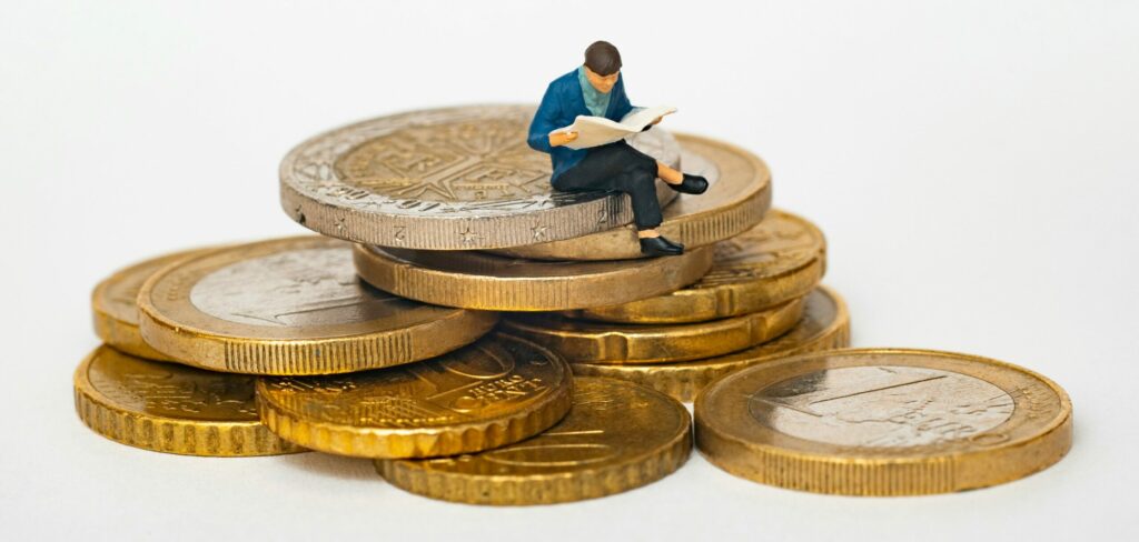 A pile of coins falling out of a jar