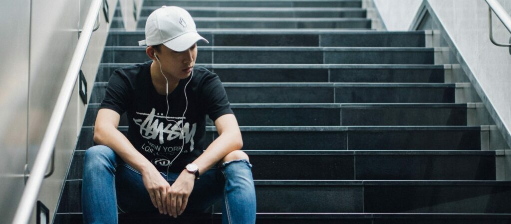 person listening panned instruments on headphones