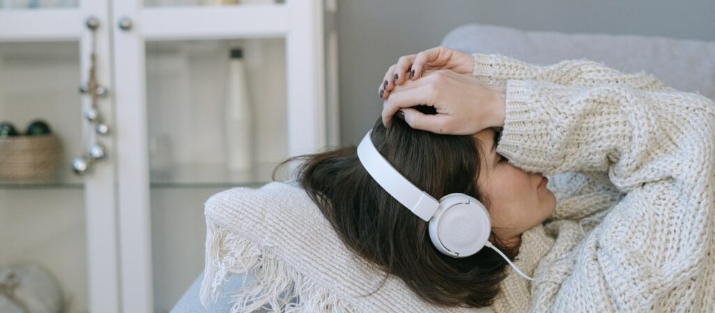 girl listening to music at home