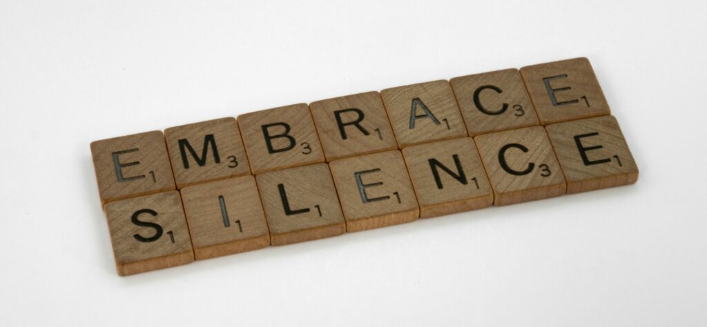 scrabble letters says silence